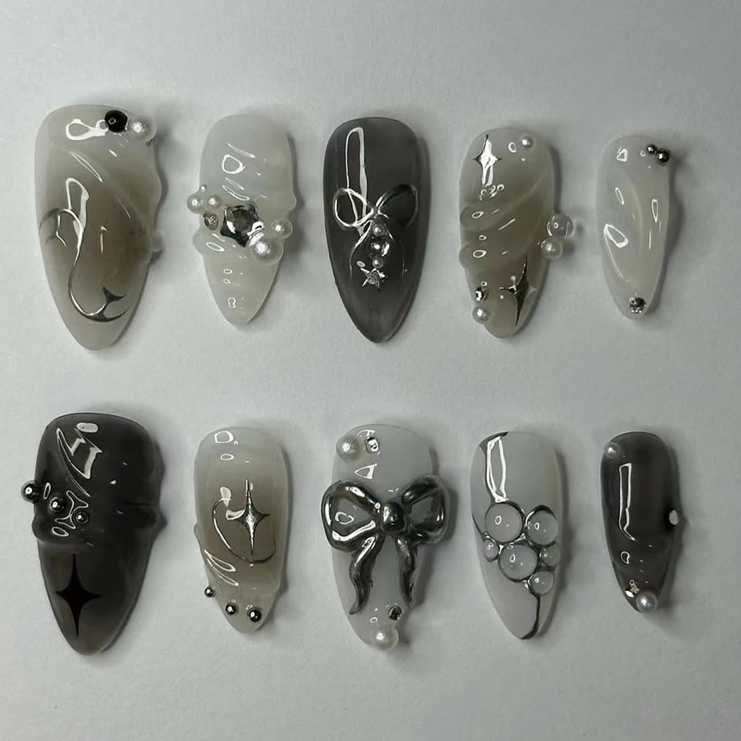 24PCS Black Press on Nails Medium Almond Fake Nails with 3D Alloy Bow Pearl Design Silver Shining Star Full Cover False Nails Water Drops French Tips Cute Stick on Nails Acrylic Fingernails for Women