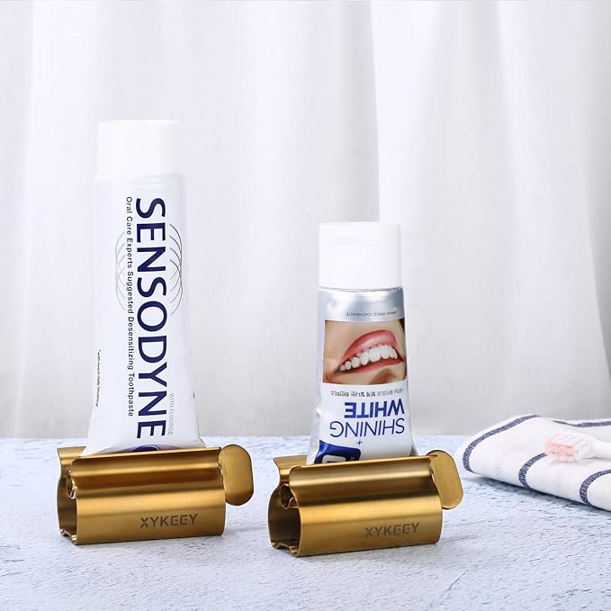 XYKEEY Toothpaste Tube Squeezer - Set of 2 Toothpaste Squeezer Rollers, Metal Toothpaste Tube Wringer Seat Holder Stand (Matt Gold)