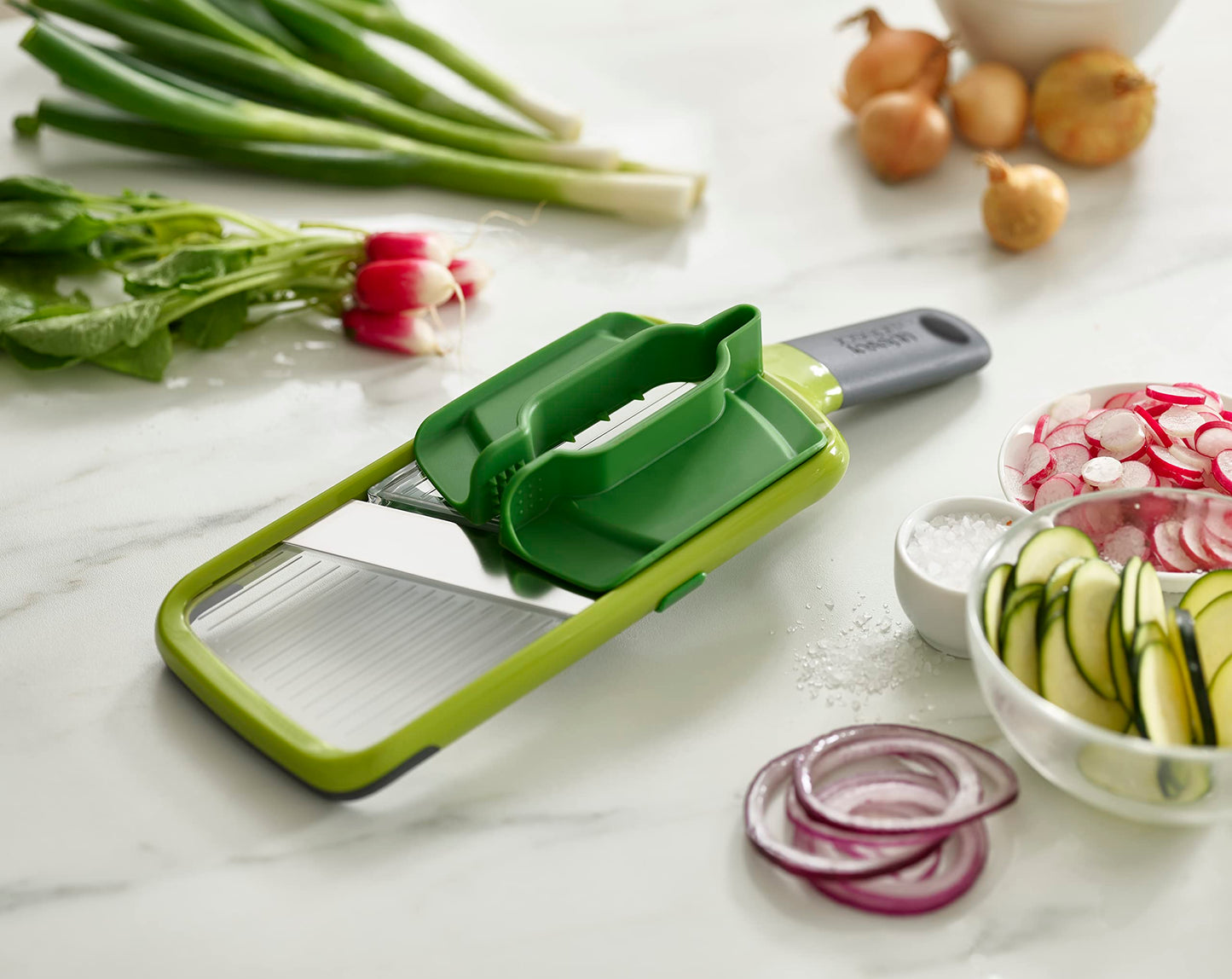Joseph Joseph Multi-Grip Hand-held Kitchen Mandoline, Fruit and Vegetable Slicer with Food Grip and Adjustable Blades, Dishwasher Safe