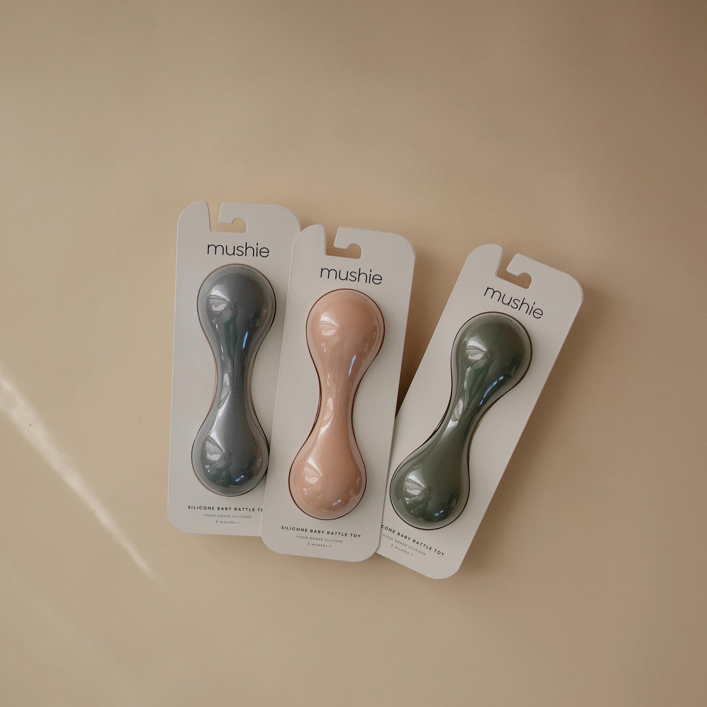 mushie Silicone Baby Shaker Rattle Toy | Ages 3+ Months (Shifting Sand)